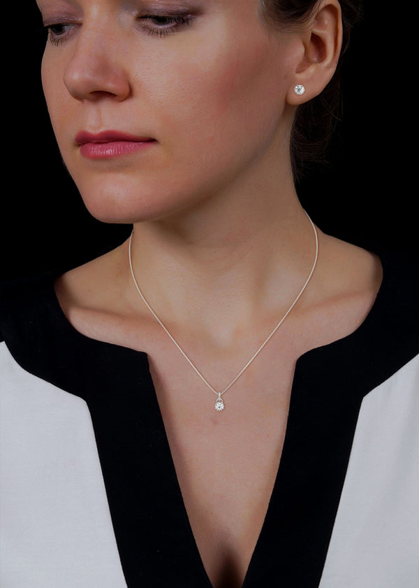 A mesmerizing rose gold jewelry set featuring dazzling round-cut diamonds framed in floral-inspired prongs, perfect for elevating any occasion with timeless sparkle.