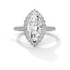 “Celestia Ring—marquise diamond brilliance, radiant halo sparkle, and pavé white-gold elegance crafted to symbolize timeless love, luxury, and unforgettable moments.”