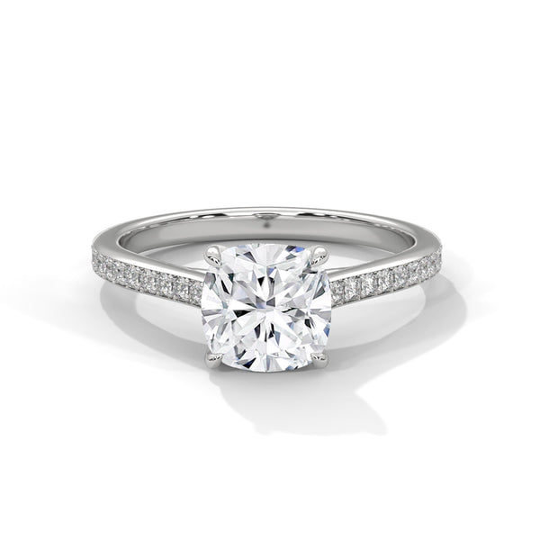 “Cushion-cut diamond solitaire ring in white gold—brilliant sparkle, pavé band elegance,and timeless luxury crafted for everlasting love.”
