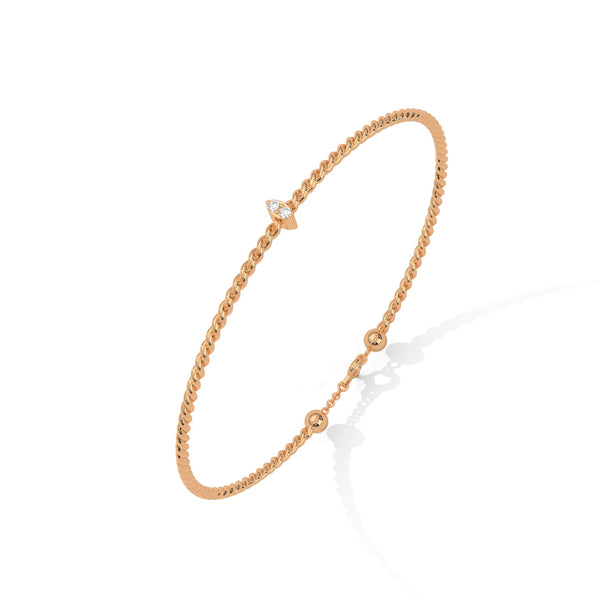 Lunara Glow is a 7-inch diamond bangle bracelet featuring 5 carats of round-cut brilliance, offering timeless elegance in a sleek, sculptural silhouette.