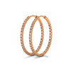 Classic hoops reimagined with a luminous row of diamonds—endless style, infinite sparkle.