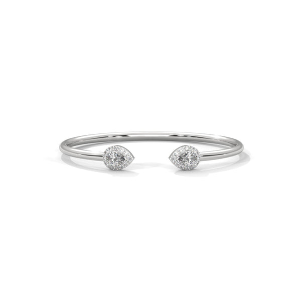 Gracefully curved and brilliantly adorned, the Luna Embrace bangle bracelet features 3.45 carats of oval-shaped diamonds in a 7-inch design—timeless elegance with a bold twist.