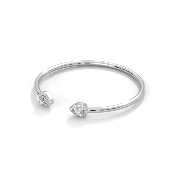 Gracefully curved and brilliantly adorned, the Luna Embrace bangle bracelet features 3.45 carats of oval-shaped diamonds in a 7-inch design—timeless elegance with a bold twist.