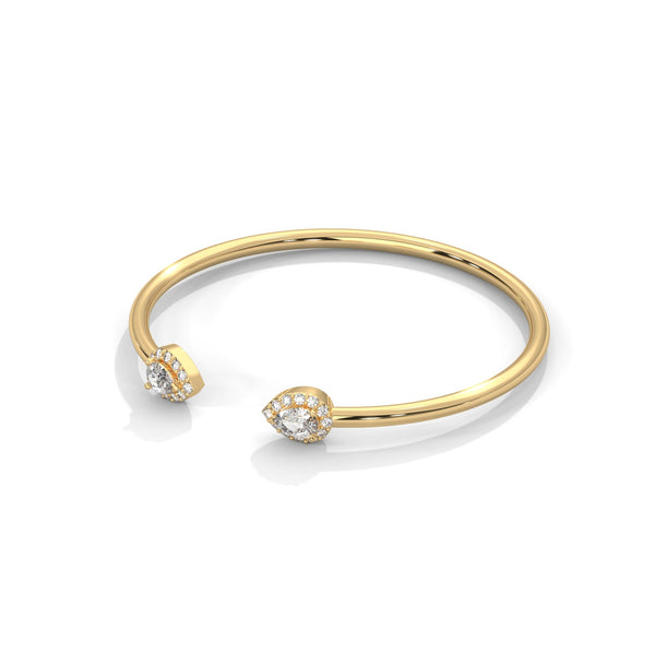 Gracefully curved and brilliantly adorned, the Luna Embrace bangle bracelet features 3.45 carats of oval-shaped diamonds in a 7-inch design—timeless elegance with a bold twist.