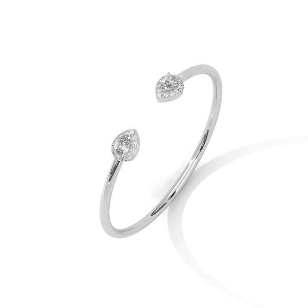 Gracefully curved and brilliantly adorned, the Luna Embrace bangle bracelet features 3.45 carats of oval-shaped diamonds in a 7-inch design—timeless elegance with a bold twist.