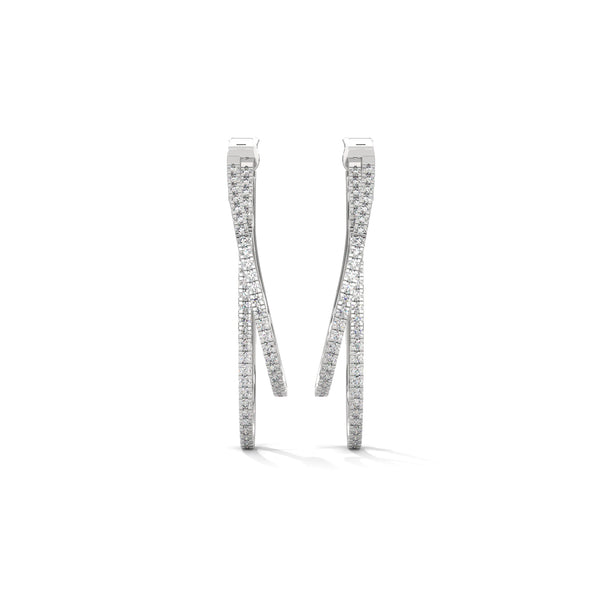 Stylishly layered gold hoops, adorned with sparkling diamonds for a bold yet elegant statement.