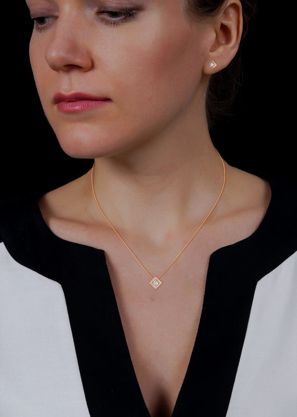 A striking rose gold jewelry set featuring square princess-cut diamonds framed in radiant round halos, combining sharp sophistication with brilliant sparkle.