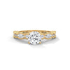 A rose gold solitaire with milgrain detailing and alternating marquise and round diamonds, capturing timeless elegance with every glance.