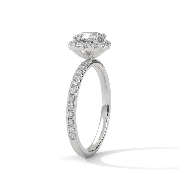 A cushion-cut lab-grown diamond surrounded by a delicate halo — timeless romance with a soft, feminine glow