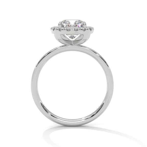 A soft cushion-shaped halo embraces a brilliant round lab-grown diamond — a romantic take on radiant sparkle.