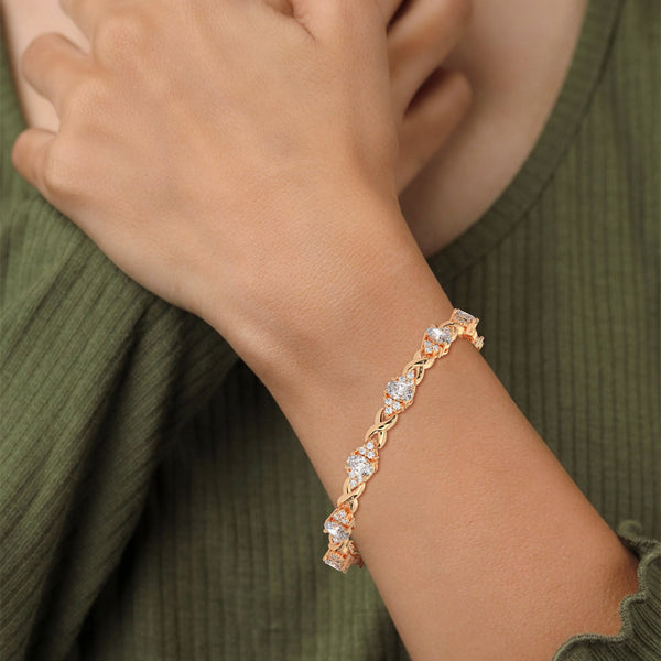 This exquisite tennis bracelet features 62 emerald-shaped diamonds, totaling 7.01 carats. With a 6.50-inch length, it is a stunning accessory that offers a perfect balance of brilliance and sophistication.