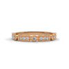 A whimsical yellow gold band featuring alternating bezel and pavé-set diamonds, creating a playful, elegant sparkle.