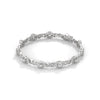 This exquisite tennis bracelet features 62 emerald-shaped diamonds, totaling 7.01 carats. With a 6.50-inch length, it is a stunning accessory that offers a perfect balance of brilliance and sophistication.