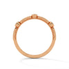 A whimsical yellow gold band featuring alternating bezel and pavé-set diamonds, creating a playful, elegant sparkle.