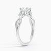 A nature-inspired masterpiece, Sylvan Bloom entwines delicate leaf motifs and shimmering diamonds into an enchanting white metal setting.