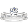 “Elegant diamond engagement ring with shimmering pavé band, crafted in timeless white gold to symbolize love, luxury, brilliance, and lifelong commitment.”