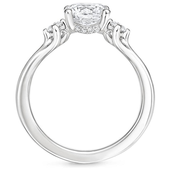 A symbol of harmony and devotion, the Lunara Grace features a round brilliant center flanked by perfectly matched side stones on a gracefully tapered band.