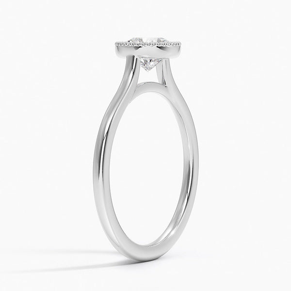 Liora Crest captures the essence of modern grace, featuring a sculptural split-shank design and a bezel-style crown accented with fine milgrain.