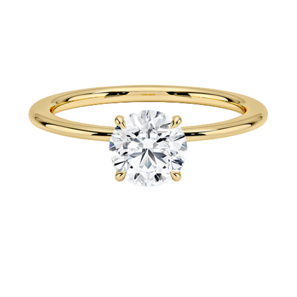 Celestia Crown radiates refined luxury, with a hidden halo of diamonds encircling the base of a dazzling round center stone in a sleek white metal setting.