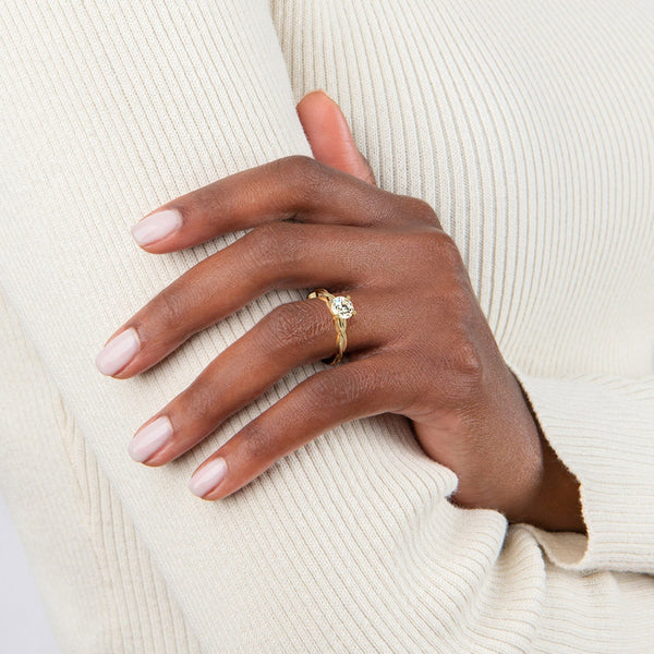 A bold expression of timeless beauty, the Solara Crest features a radiant round diamond set atop a luminous yellow gold band—classic, confident, and endlessly elegant.
