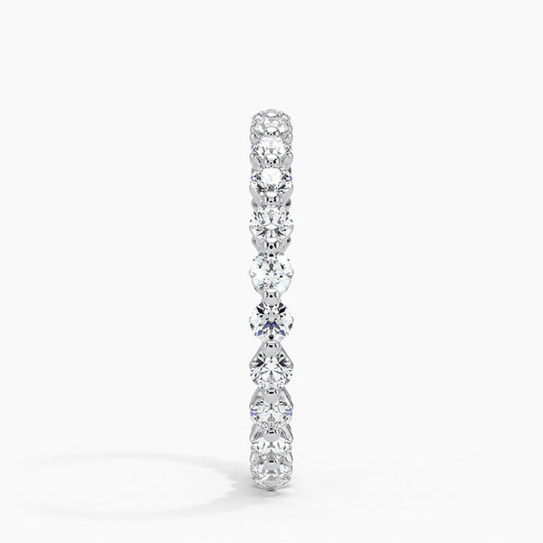 “Elegant diamond eternity ring crafted in shimmering white metal, showcasing brilliant round stones for timeless sparkle, luxury style, and lasting sophistication.”