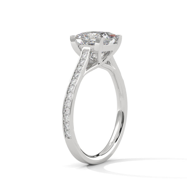 “Aria Ring—princess-cut diamond brilliance, sleek four-prong elegance, and pavé-band sparkle crafted to symbolize modern beauty, timeless love, and unforgettable moments.”
