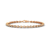 This luxurious tennis bracelet features 40 emerald-shaped diamonds, totaling 14.55 carats. With a 7-inch length, it offers an elegant, timeless design that adds exceptional brilliance to any occasion.