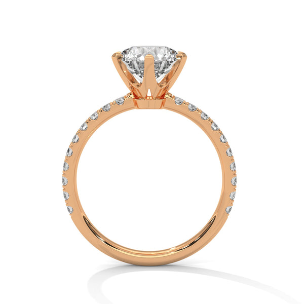 “Celestia Ring—round-cut diamond brilliance, secure six-prong elegance, and pavé-band sparkle crafted to symbolize timeless beauty, lasting love, and radiant sophistication.”