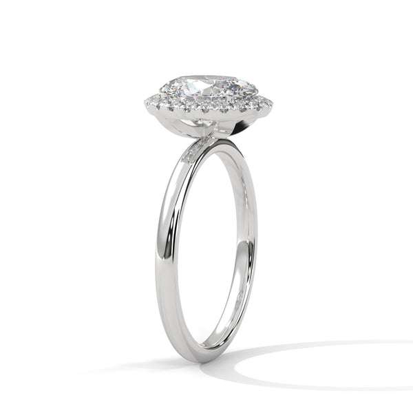 A graceful oval-cut lab-grown diamond encircled by a shimmering halo — effortless elegance with eye-catching brilliance
