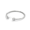 Gracefully curved and brilliantly adorned, the Luna Embrace bangle bracelet features 3.45 carats of oval-shaped diamonds in a 7-inch design—timeless elegance with a bold twist.