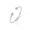 Gracefully curved and brilliantly adorned, the Luna Embrace bangle bracelet features 3.45 carats of oval-shaped diamonds in a 7-inch design—timeless elegance with a bold twist.