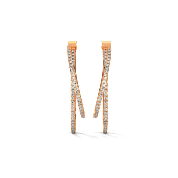 Stylishly layered gold hoops, adorned with sparkling diamonds for a bold yet elegant statement.