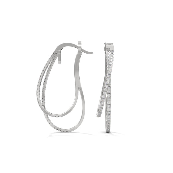 Stylishly layered gold hoops, adorned with sparkling diamonds for a bold yet elegant statement.