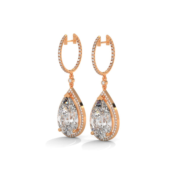 Dramatic rose gold danglers with pear-shaped centerpieces and a cascade of diamonds for breathtaking brilliance.