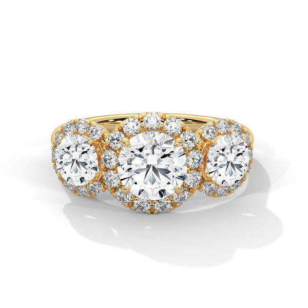 “Celebrate everlasting love with a three-stonehalo diamond ring that shines with brilliant sparkle, luxury craftsmanship, and timeless elegance.”