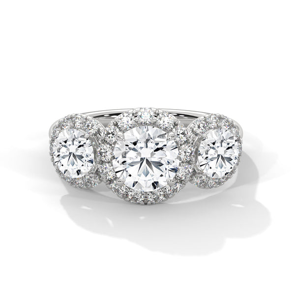 “Celebrate everlasting love with a three-stonehalo diamond ring that shines with brilliant sparkle, luxury craftsmanship, and timeless elegance.”