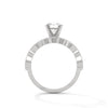 A rose gold solitaire with milgrain detailing and alternating marquise and round diamonds, capturing timeless elegance with every glance.