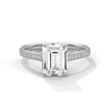 The Celestial Elegance Ring features a striking emerald-cut diamond embraced by a delicate band adorned with shimmering pave stones. A timeless piece that symbolizes everlasting love and sophistication.