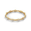 This exquisite tennis bracelet features 62 emerald-shaped diamonds, totaling 7.01 carats. With a 6.50-inch length, it is a stunning accessory that offers a perfect balance of brilliance and sophistication.