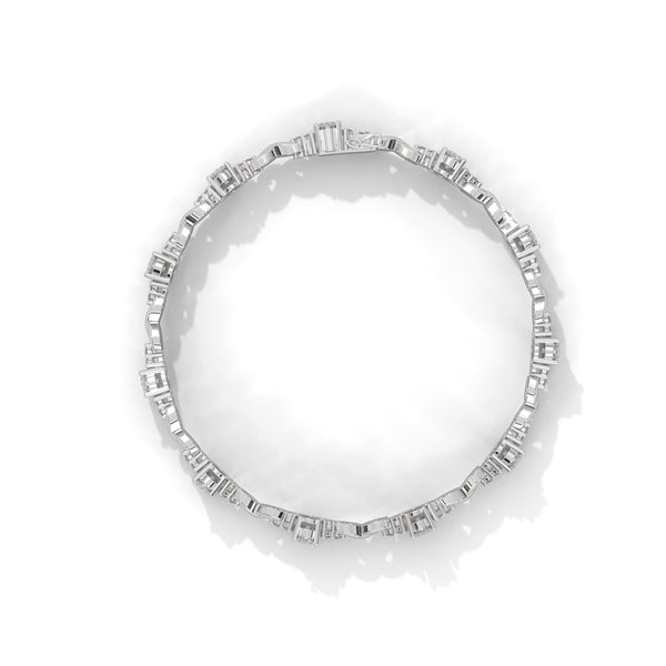 This exquisite tennis bracelet features 62 emerald-shaped diamonds, totaling 7.01 carats. With a 6.50-inch length, it is a stunning accessory that offers a perfect balance of brilliance and sophistication.