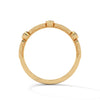 A whimsical yellow gold band featuring alternating bezel and pavé-set diamonds, creating a playful, elegant sparkle.