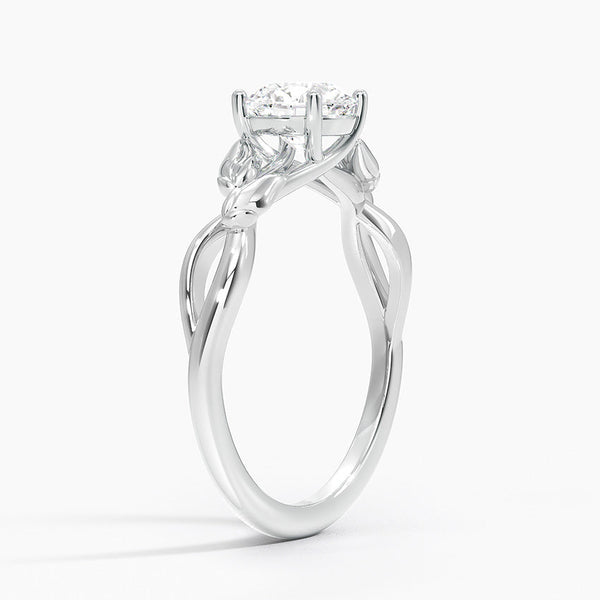 A nature-inspired masterpiece, Sylvan Bloom entwines delicate leaf motifs and shimmering diamonds into an enchanting white metal setting.