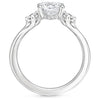 A symbol of harmony and devotion, the Lunara Grace features a round brilliant center flanked by perfectly matched side stones on a gracefully tapered band.