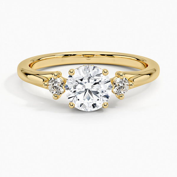 A symbol of harmony and devotion, the Lunara Grace features a round brilliant center flanked by perfectly matched side stones on a gracefully tapered band.