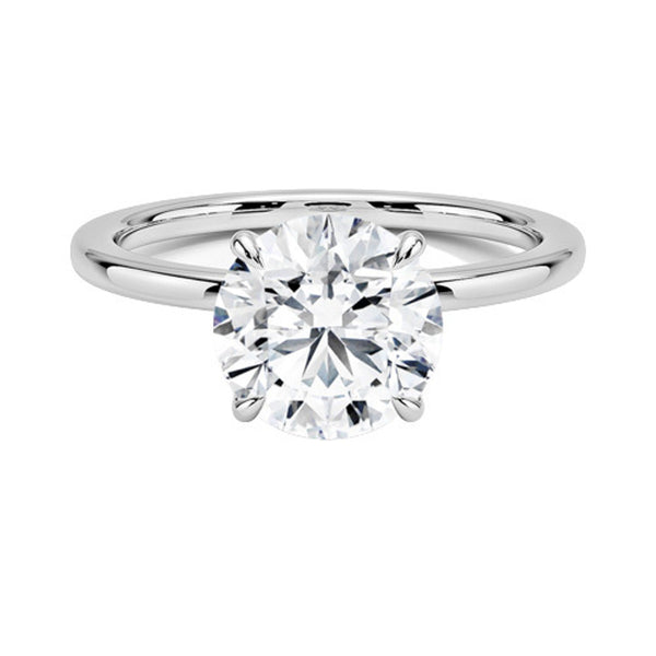 A round brilliant solitaire embraced by an intricate vine-inspired setting, intertwining elegance and organic artistry.