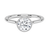 Liora Crest captures the essence of modern grace, featuring a sculptural split-shank design and a bezel-style crown accented with fine milgrain.