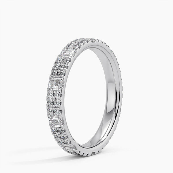 Radiate timeless elegance with this yellow-gold diamond band, featuring brilliant round and baguette stones for a luxurious, sparkling statement of everlasting love.