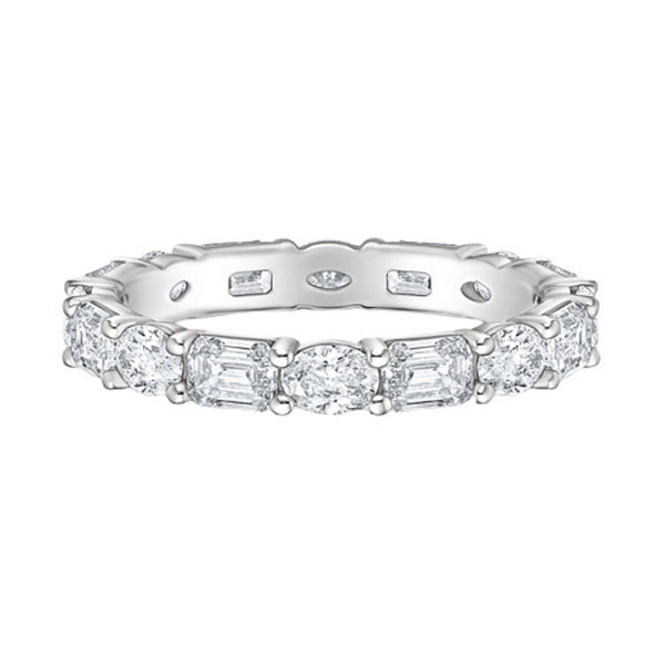 "Luxurious oval and emerald-cut diamond eternity ring crafted in radiant white gold, delivering timeless brilliance, elite craftsmanship, and unmatched elegance."