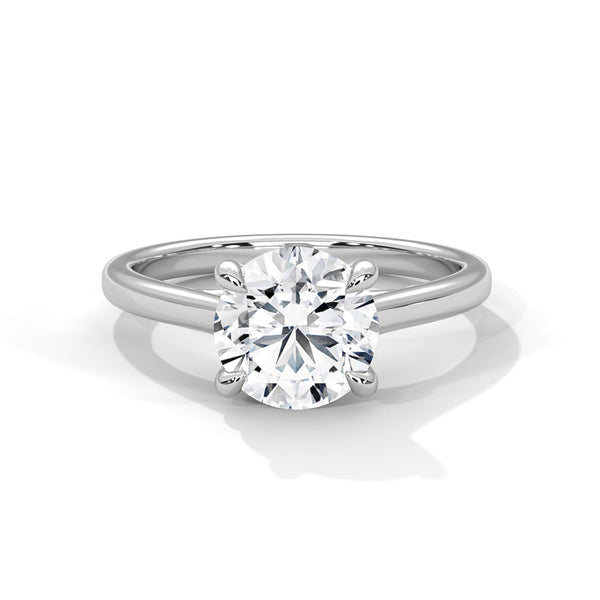 “Aurora Ring—round brilliant diamond sparkle, classic six-prong elegance, and timeless solitaire beauty crafted to symbolize enduring love, refined style, and radiant grace.”
