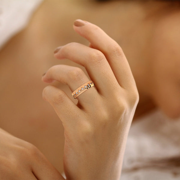 “A bold gold diamond band featuring intricate geometric detailing and sparkling brilliance, crafted for timeless elegance and standout everyday luxury.”.